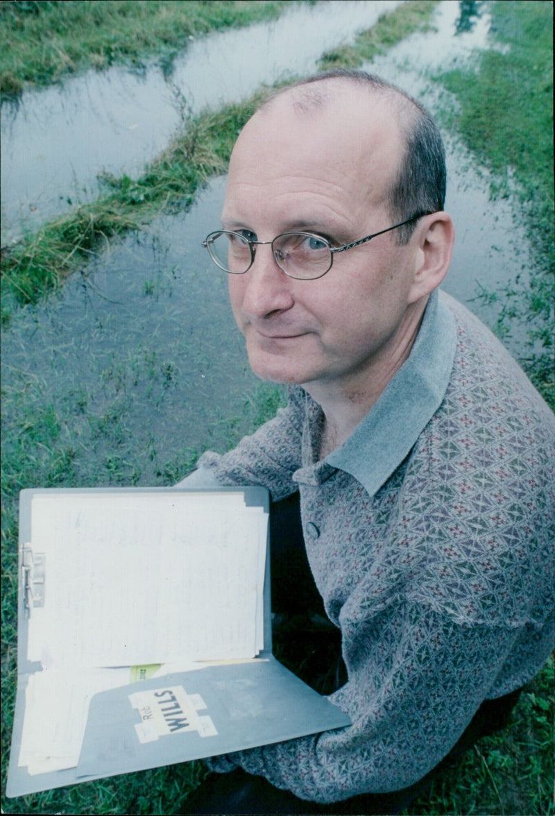 Rob Wills leads local residents in protesting against vandalism and flooding at the Shakespear Drive Nature Reserve. - Vintage Photograph