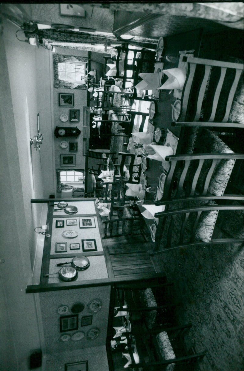 The Rose Revived, an inn located along the river in Oxfordshire, UK, offers a unique experience with its refurbished Victorian-style interior, a la carte breakfast, and comprehensive selection of drinks. - Vintage Photograph