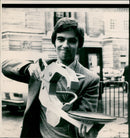 A 1961 Mercedes-Benz 120 SL on display at an auto show. - Vintage Photograph