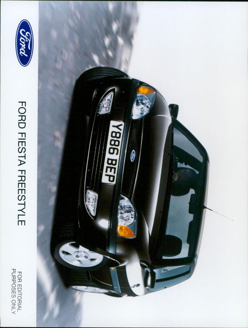 A Ford Fiesta Freestyle is seen parked in a street. - Vintage Photograph