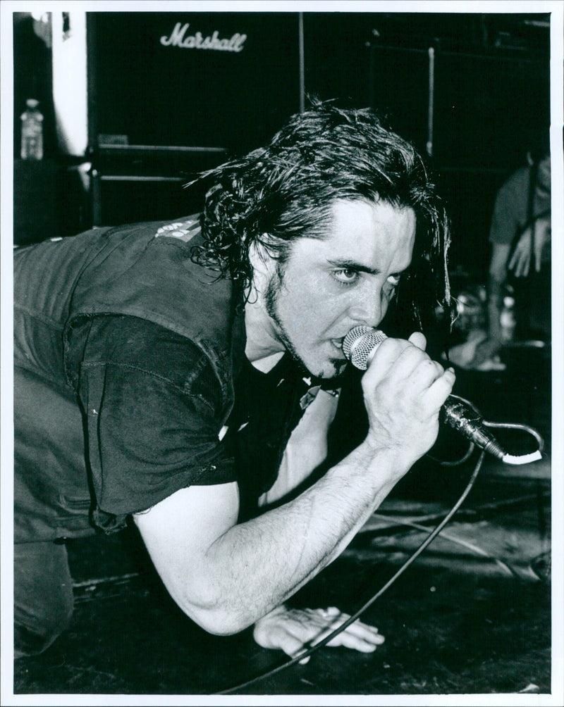Marshall 10.10.32 perform at a live music event. - Vintage Photograph