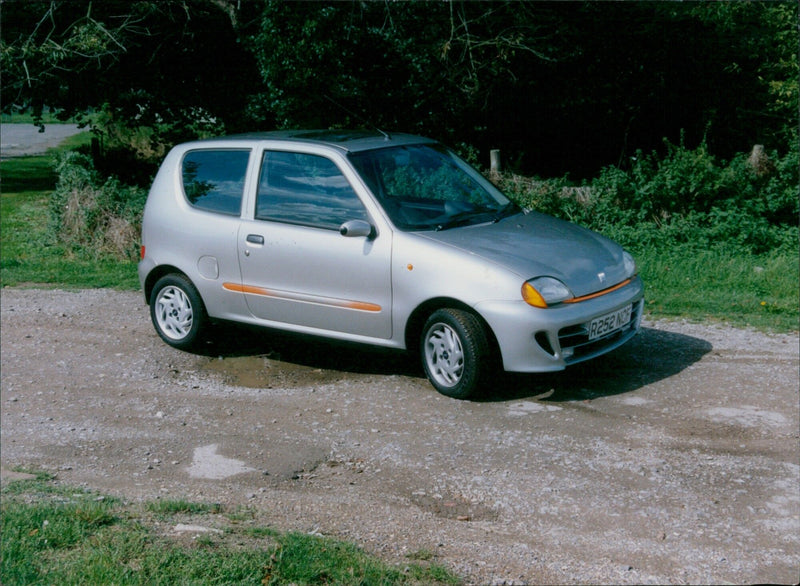 A Fiat Siecento parked in Cholsey Moore, England. - Vintage Photograph