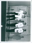 A group of music students playing instruments in a music classroom. - Vintage Photograph