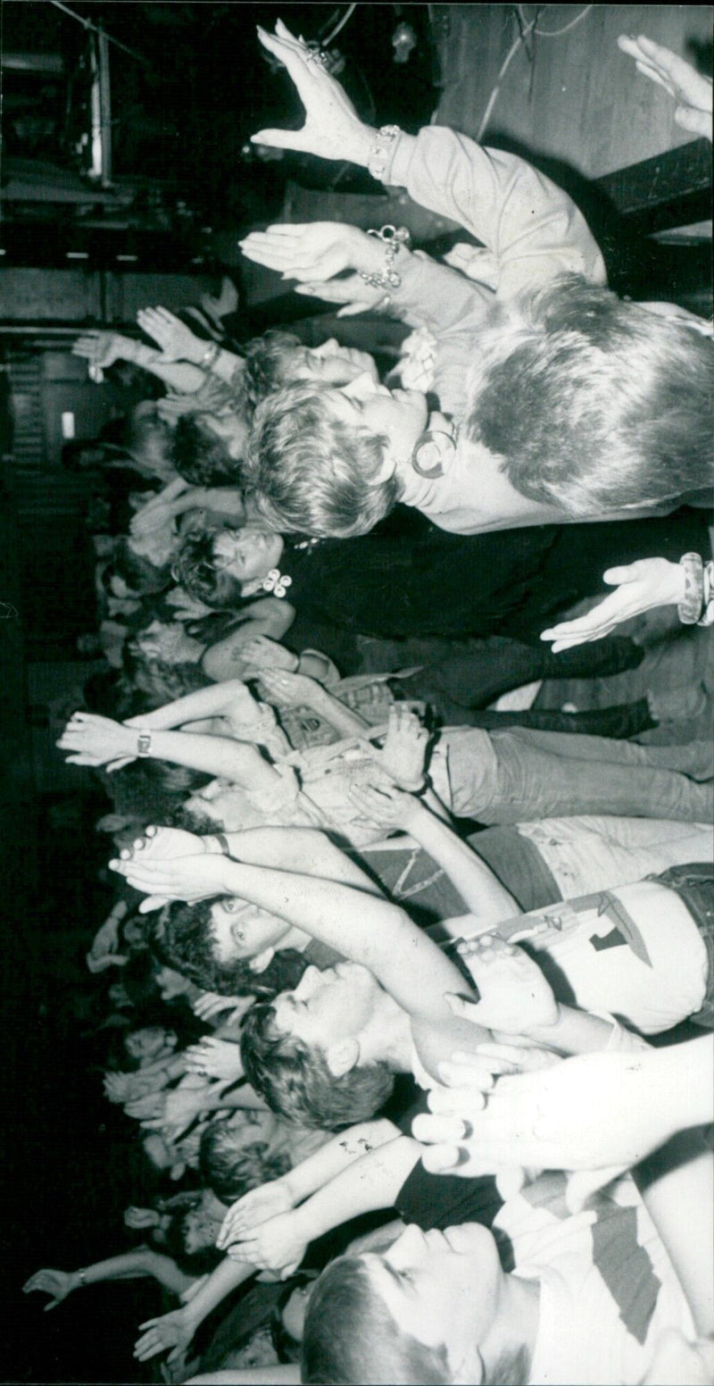 An enthusiastic crowd attends a Live Aid concert in Wantage, England. - Vintage Photograph