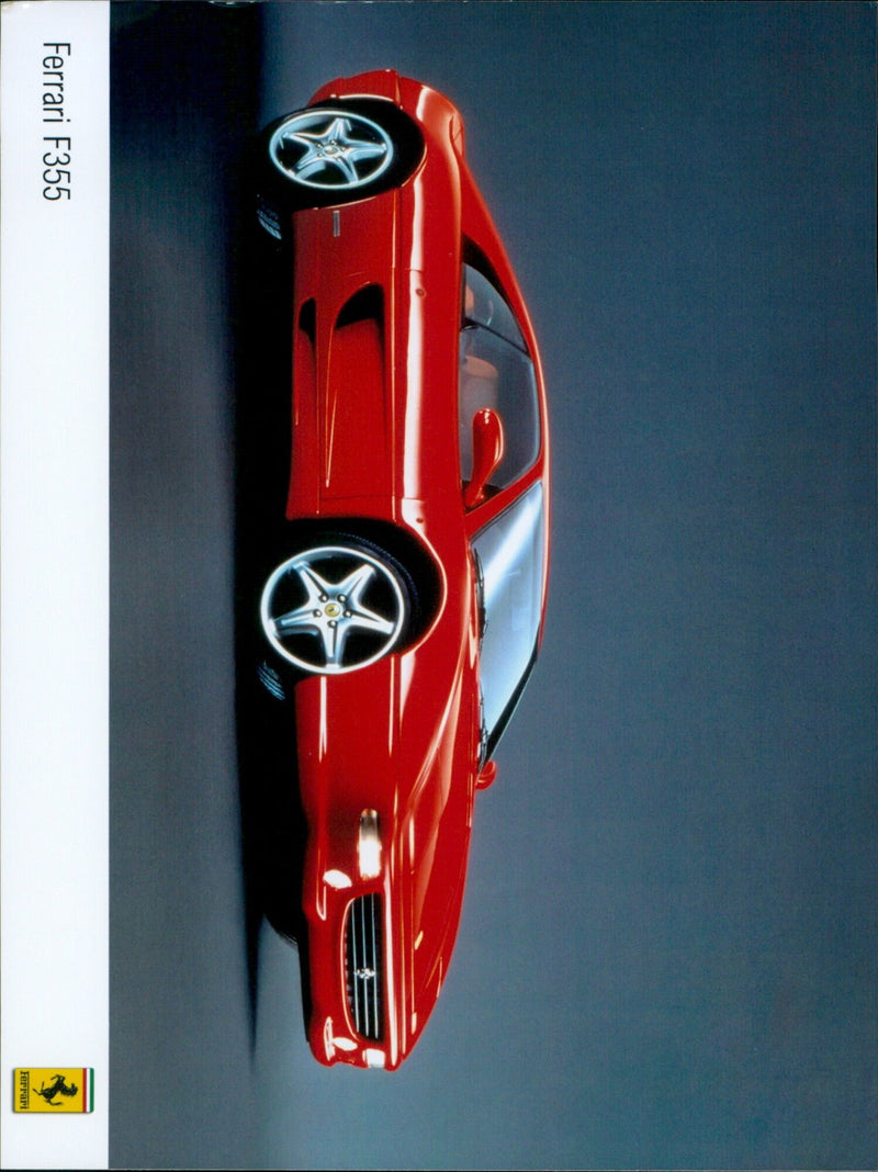 A red Ferrari F355 rests in an empty parking lot. - Vintage Photograph