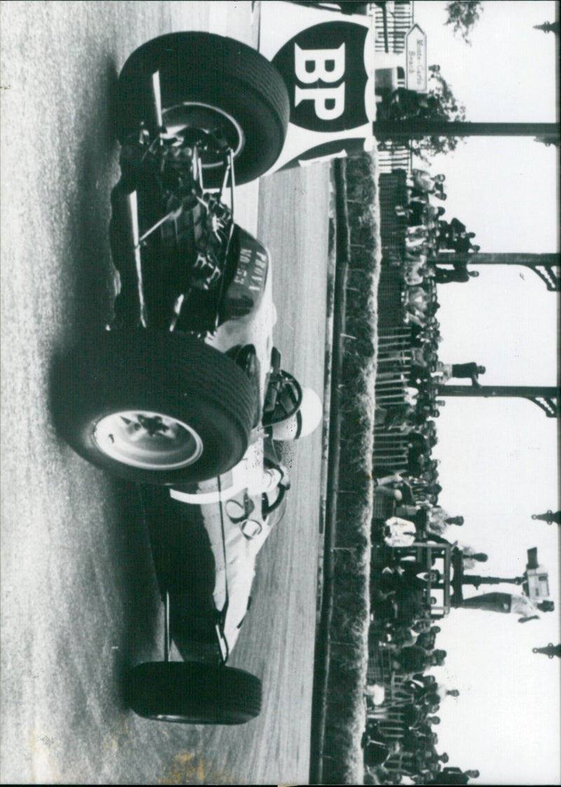 Geoffrey Lorenzo Bandini driving the Ferrari in the 1965 Monaco Grand Prix. - Vintage Photograph