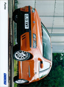 A Fiat EL51 XMY car parked at the side of a road. - Vintage Photograph