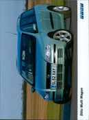 A Stilo Multi Wagon GB Fiat SL52 XAY car is seen parked in a lot. - Vintage Photograph