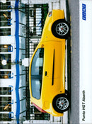 An Abarth Punto HGT LUET 2150 FIAT car drives around a race track. - Vintage Photograph