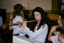 Anna Bloomfield, 17, plays a musical instrument. - Vintage Photograph