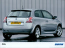 A Fiat DY53 KDF Stilo car is seen in a car showroom. - Vintage Photograph