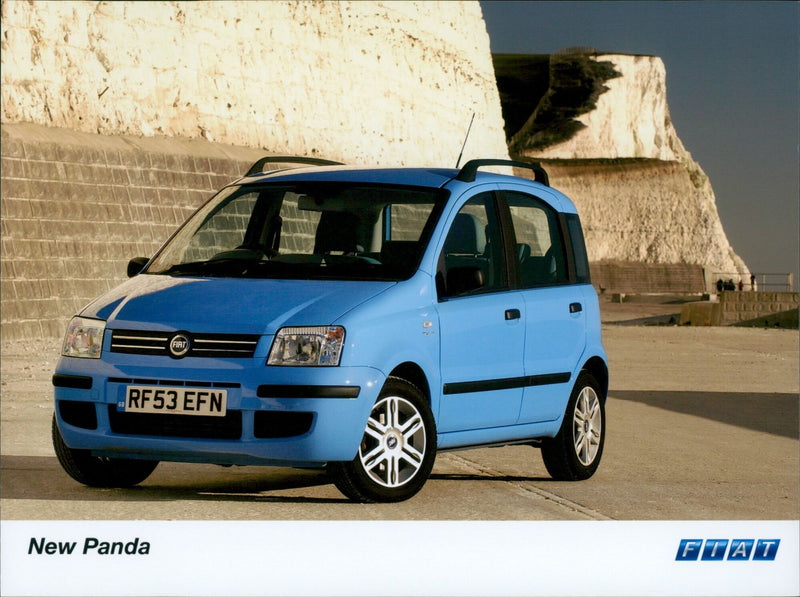 A Fiat RF53 EFN New Panda TESZE ΕΠΑΙΤ E EYES MMMMS being shown off at an auto show. - Vintage Photograph