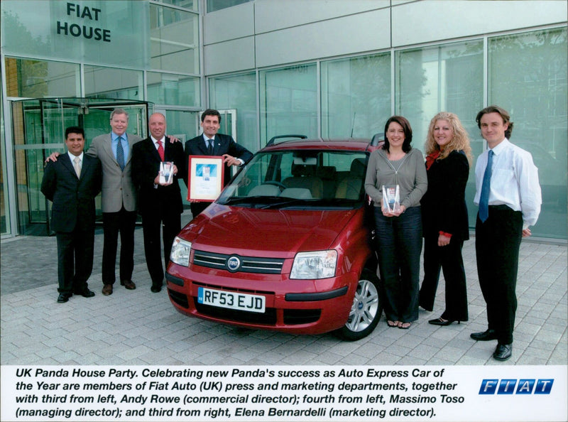 Fiat Auto (UK) press and marketing members celebrate the new Panda's success as Auto Express Car of the Year. - Vintage Photograph