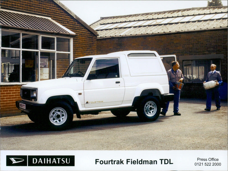 A D Daihatsu Fourtrak Fieldman TDL is seen driving in a field. - Vintage Photograph