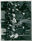 Musician Kamé poses with two guitars in January 2021. - Vintage Photograph