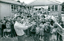WANTAGE SILVERBAND members give themselves a musical welcome to the newly-acquired school premises. - Vintage Photograph