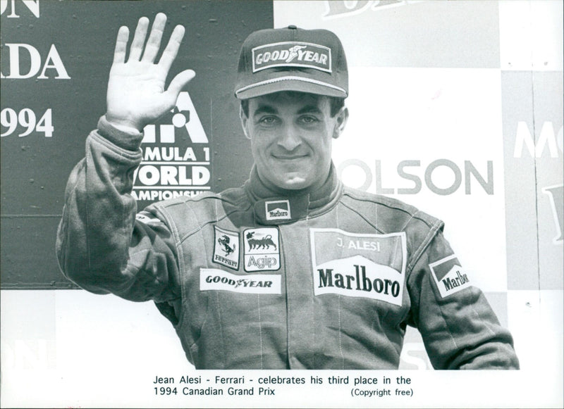 Ferrari's Jean Alesi celebrates his third-place finish at the 1994 Canadian Grand Prix. - Vintage Photograph