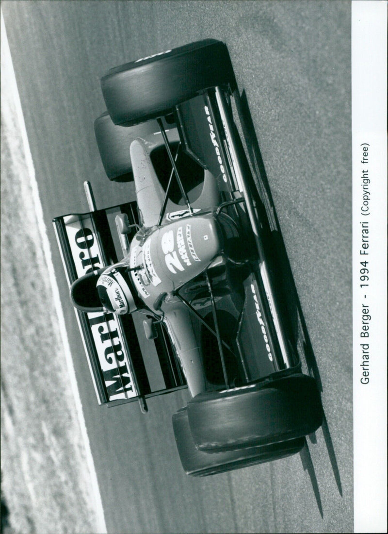 Gerhard Berger driving a Ferrari during the Pacific Grand Prix in 1994. - Vintage Photograph