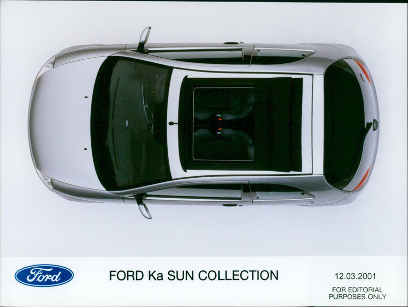 A Ford Ka car sits in the sun. - Vintage Photograph