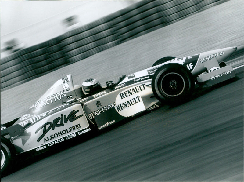 Michael Schumacher celebrates his 1995 French Grand Prix win with his Benetton Renault team. - Vintage Photograph