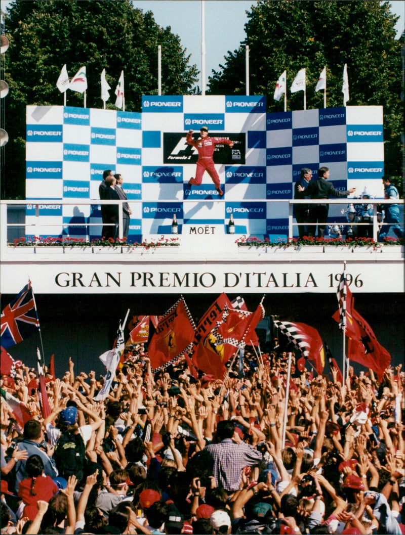 Michael Schumacher celebrates his win of the 1996 Italian Grand Prix. - Vintage Photograph