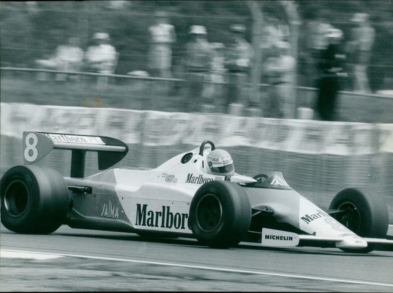Niki Lauda competes in a Marlboro-sponsored car during a race at the Hringra Circuit. - Vintage Photograph