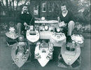 Don Willis and Len Thomas proudly display their radio-controlled racing model boats. - Vintage Photograph