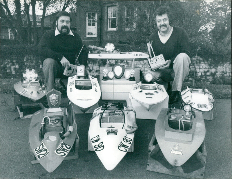 Don Willis and Len Thomas proudly display their radio-controlled racing model boats. - Vintage Photograph