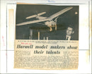 On September 25, 1965, model makers at Harwell Atomic Energy Research Establishment's Model Club held an exhibition showcasing their hand-built creations with intricate accuracy. - Vintage Photograph
