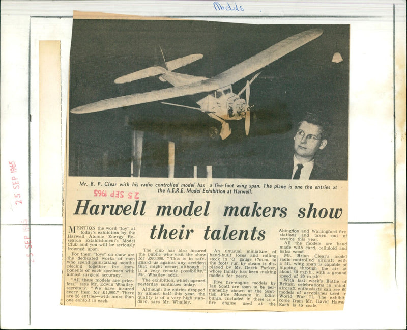 On September 25, 1965, model makers at Harwell Atomic Energy Research Establishment's Model Club held an exhibition showcasing their hand-built creations with intricate accuracy. - Vintage Photograph