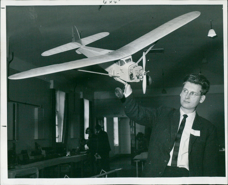 On September 25, 1965, model makers at Harwell Atomic Energy Research Establishment's Model Club held an exhibition showcasing their hand-built creations with intricate accuracy. - Vintage Photograph