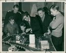 Boys and their fathers enjoy a model racing car circuit at Banbury Salvation Army's fair. - Vintage Photograph