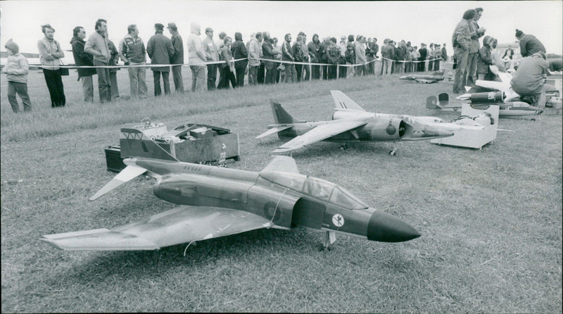 Miniature jets stand ready to go through their paces in front of an appreciative crowd at a model aircraft display in Abingdon, England. - Vintage Photograph