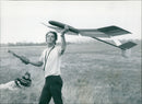 Neil Webb launching a model glider in Weston on the Green. - Vintage Photograph