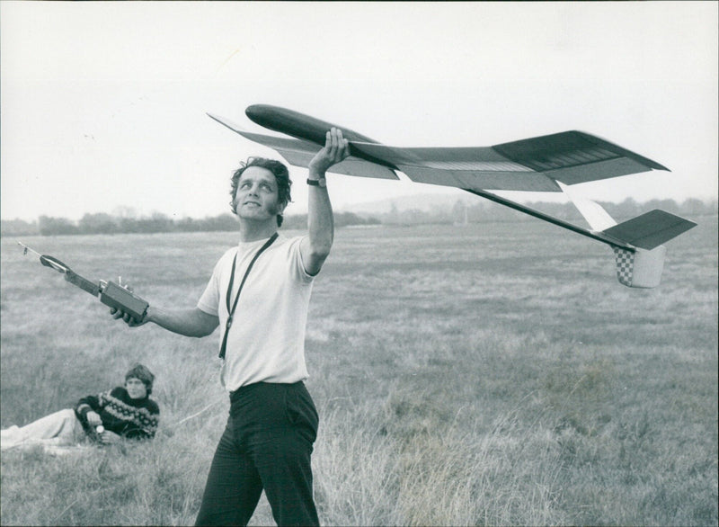 Neil Webb launching a model glider in Weston on the Green. - Vintage Photograph