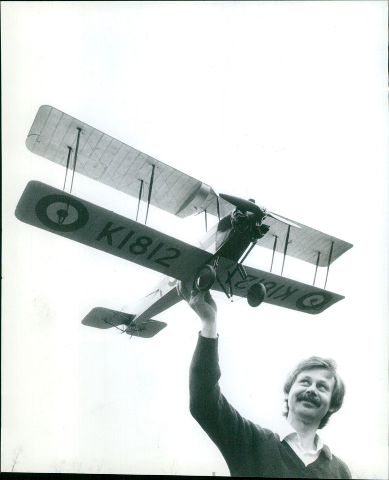 Charles Newman with a model of an Avro biplane. - Vintage Photograph