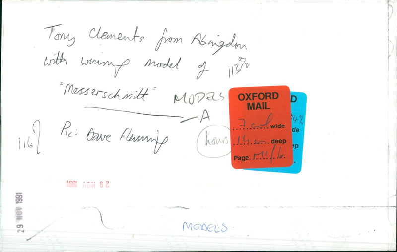 Tony Clements from Abingdon poses with a Messerschmitt plane model. - Vintage Photograph