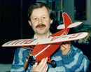 Charles Newman building a model plane with a Comper Swift - Vintage Photograph