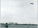 John flies his model plane around at speeds of up to 70 mph. - Vintage Photograph