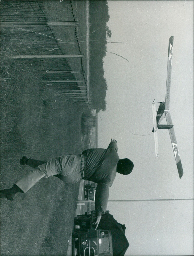Carlo Mapelli throws his home-made model aircraft, which has covered a distance of 200 miles, in Lainate, Italy. - Vintage Photograph