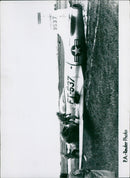 A damaged F-80 jet fighter, evidence of intense ground fire, successfully lands at an emergency air strip in Southern Korea. - Vintage Photograph