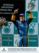 Fernando Alonso of the Mild Seven Renault F1 Team celebrates his first podium finish at the 2003 Malaysian Grand Prix. - Vintage Photograph