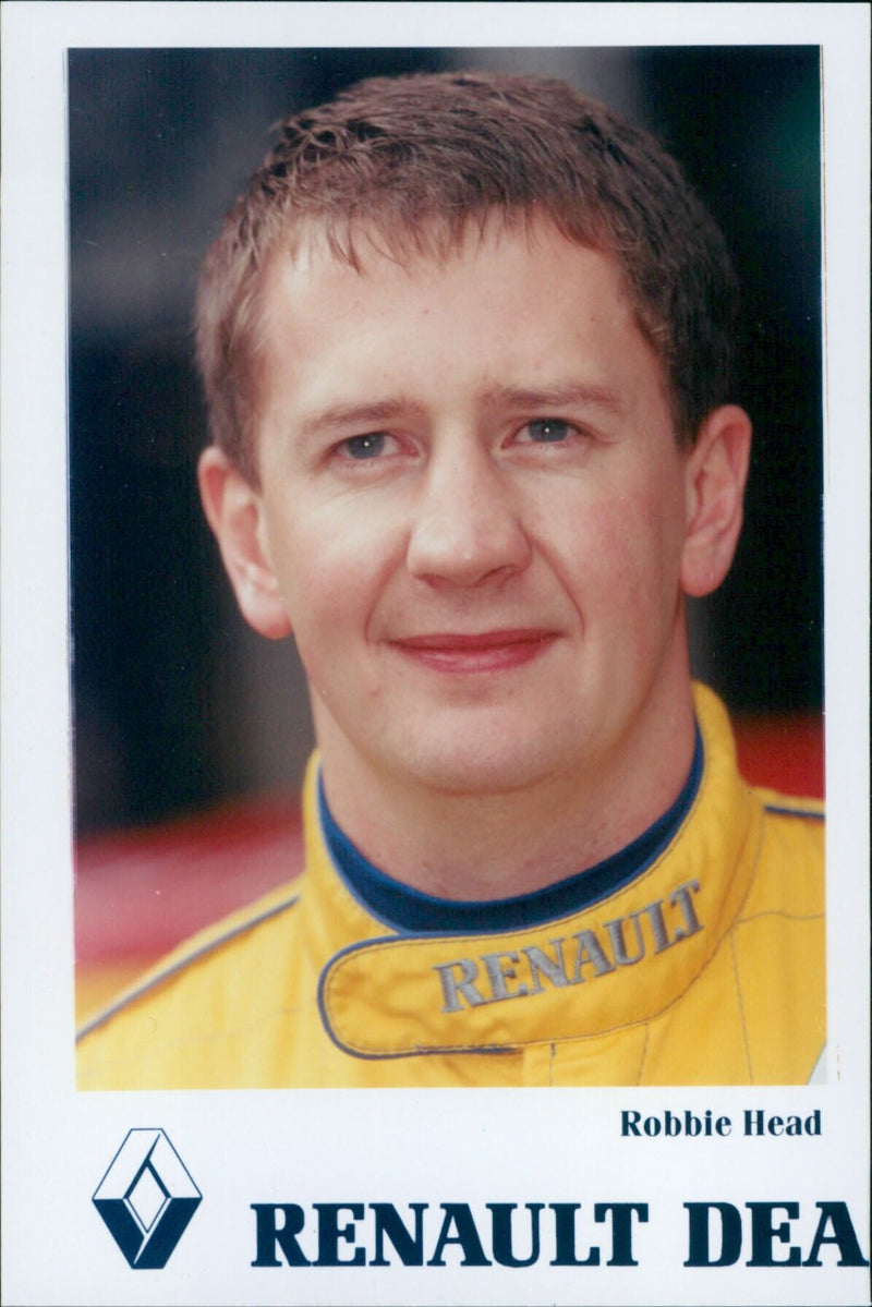 Robbie Head of Renault DEA speaks at a press conference. - Vintage Photograph