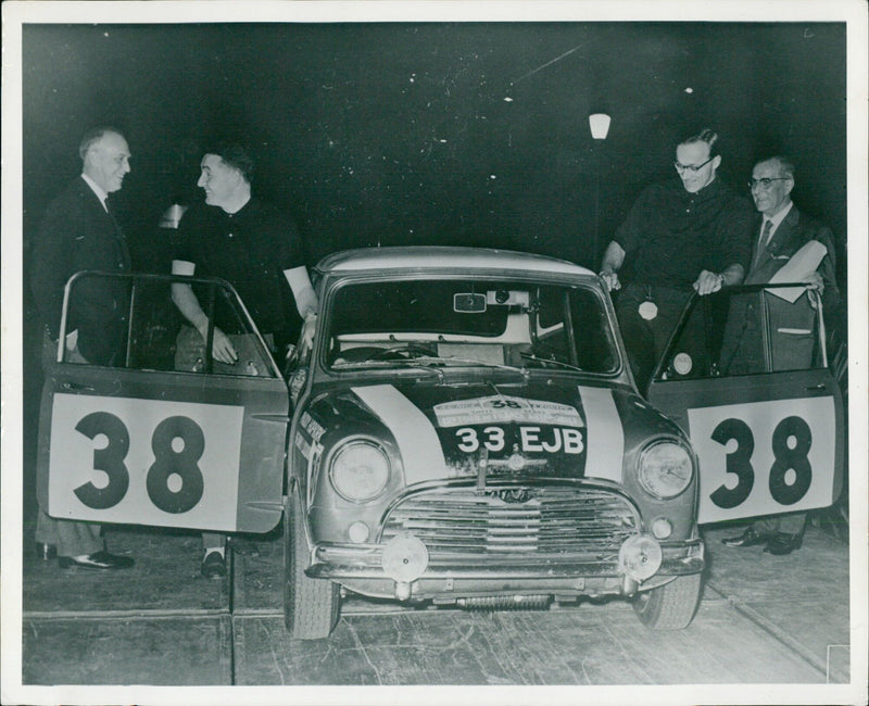 Paddy Hopkirk and Henry Liddon in a Morris Cooper during the 1963 Tour de France. - Vintage Photograph