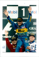 Michael Schumacher driving a Ferrari F310B during a practice session of the 1998 Italian Grand Prix in Monza, Italy. - Vintage Photograph