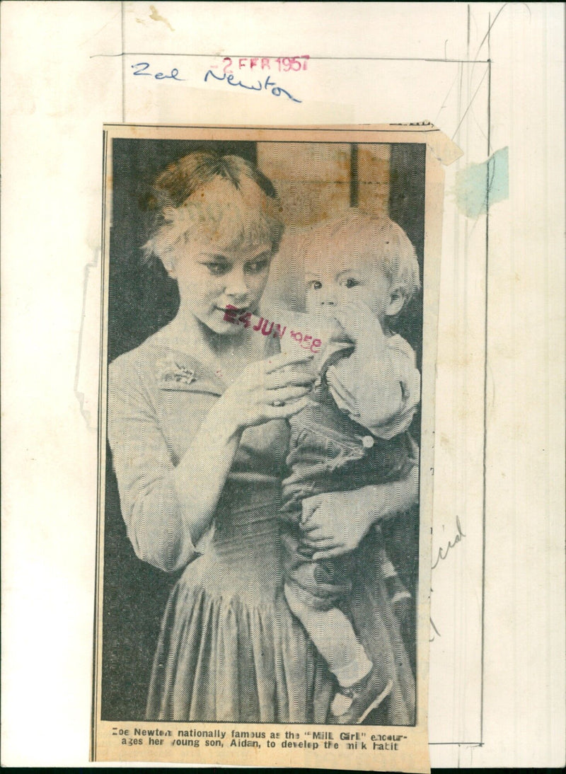 Zal Newton, the nationally famous Mill Girl, encourages her son Aidan to develop his musical talents. - Vintage Photograph