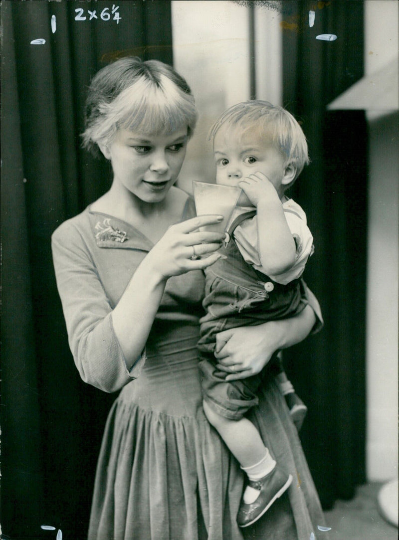 Zal Newton, the nationally famous Mill Girl, encourages her son Aidan to develop his musical talents. - Vintage Photograph