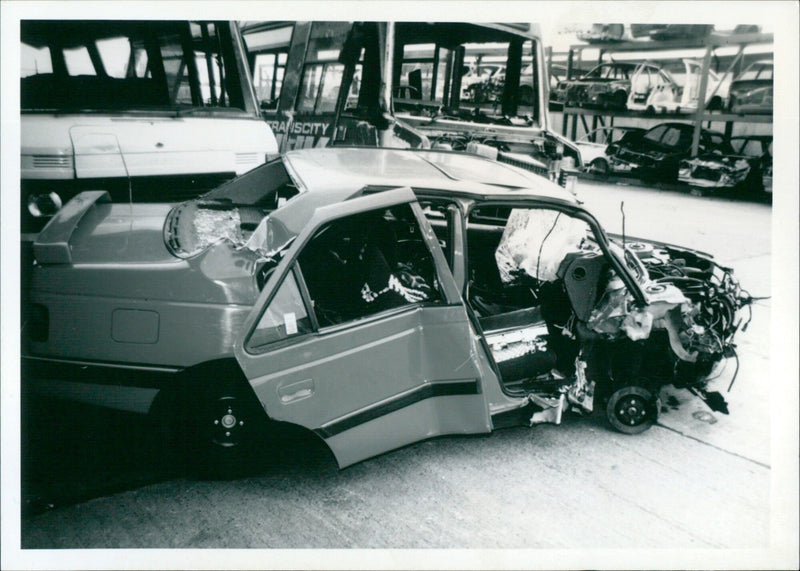 A Peugeot 405 SRi beyond repair after being targeted by criminals. - Vintage Photograph