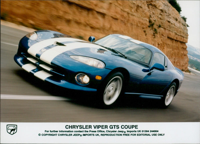 The Chrysler Viper GTS Coupe is seen on a sunny day. - Vintage Photograph