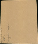 A Chrysler Viper is seen in a garage. - Vintage Photograph